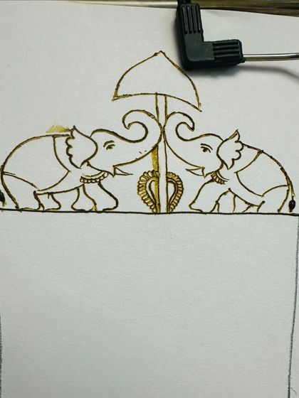 The top element of the bridal design, featuring traditional elephants. I teach how to draw these motifs to add a royal touch to any mehandi.