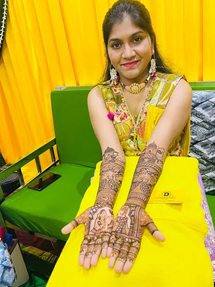 A beautiful shot of the bride displaying her completed mehndi. We love capturing these moments of joy after our work is done.