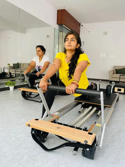 A duet reformer session in action. Working out with a partner is a great way to stay motivated and ensure proper form.