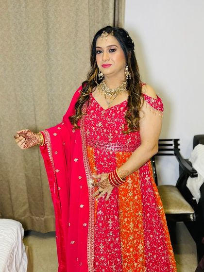 A playful pose, showing off her mehndi.