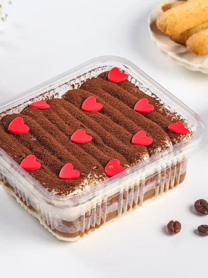 Spreading the love with our Valentine's Day special Tiramisu dessert tub. This classic coffee and cream dessert is decorated with little red hearts, making it a perfect treat to share with your special someone.
