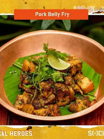 Another shot of the popular Pork Belly Fry, garnished with fresh coriander and lime.