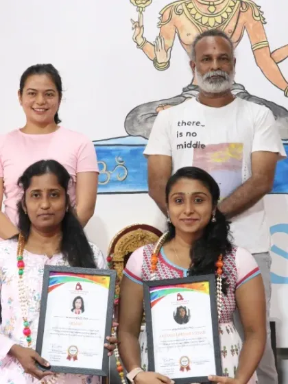 Two more students proudly display their Aerial Yoga TTC certificates. Their hard work and dedication to the practice have truly paid off.