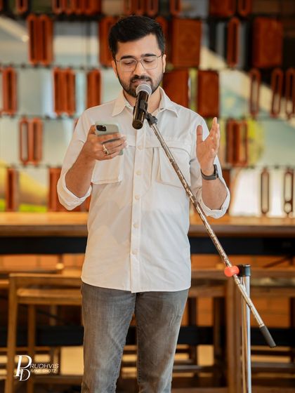 A performer reads from his phone, contributing his voice to our "Love Without Labels" session. Every poem added to the celebration of unfiltered and unapologetic love.