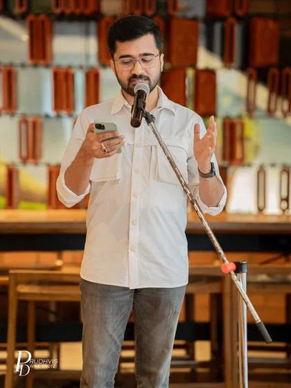 A performer reads from his phone, contributing his voice to our "Love Without Labels" session. Every poem added to the celebration of unfiltered and unapologetic love.
