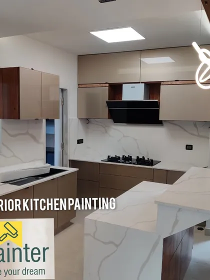 A modern kitchen project featuring sleek, professionally painted cabinets and walls. A quality paint job is essential for a clean and inviting kitchen space.