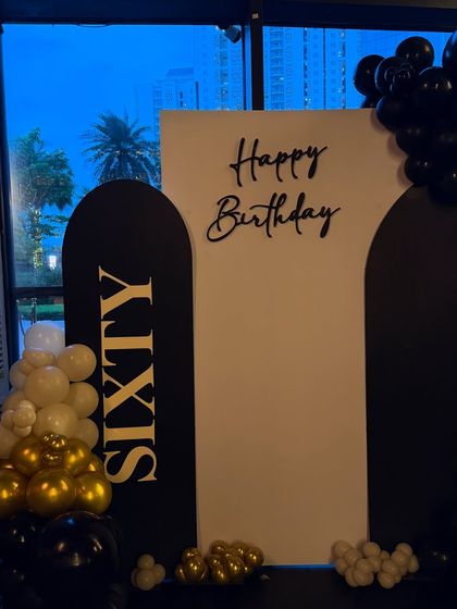 A clean, bold backdrop we designed for a 60th birthday at Whiskey Samba, Gurgaon. The black and white panels with gold and black lettering create a timeless and sophisticated look, perfect for a landmark celebration.