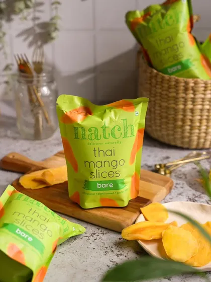 A bright and fresh lifestyle shot for a snack brand. I used a wooden board and natural light to create a healthy, wholesome vibe for these bare mango slices.