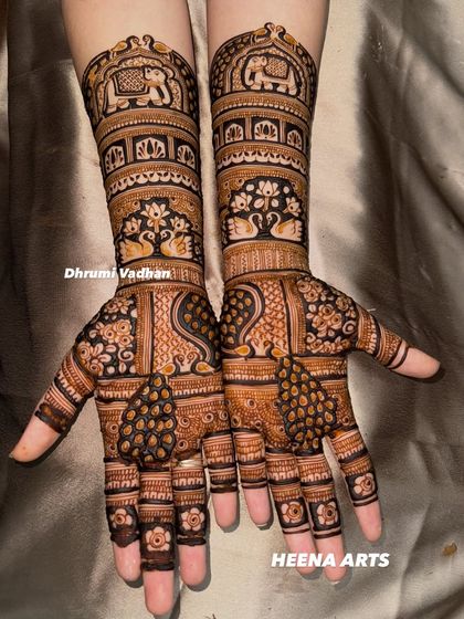 A special design for the bride's bhabhi, featuring traditional motifs like elephants and swans, fit for a key member of the wedding party.