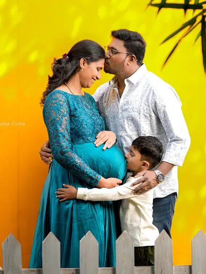 Welcoming a new member to the family is a joy for everyone. We captured this beautiful moment with the mom-to-be, dad, and their excited older son during a vibrant studio maternity session. These are the memories that last a lifetime.