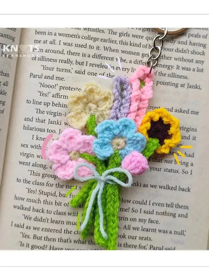 A tiny crochet bouquet that lasts forever. This keychain features a mix of miniature flowers, including a sunflower and a tulip, all bundled up.