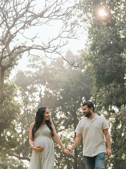 Walking together towards their greatest adventure. The soft, hazy sunlight in the park created such a magical atmosphere for this couple's maternity shoot.