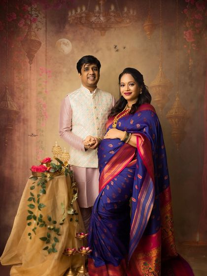 A classic couple's portrait perfect for the festival of lights. The couple stands together in traditional attire, creating a timeless image of their love and anticipation.
