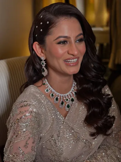 A portrait of the bride for her Walima, her smile radiant and her makeup dewy and fresh.