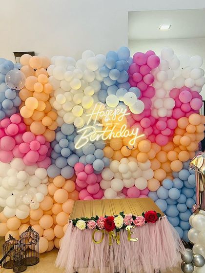 A close-up of the dense and colorful balloon wall, showcasing the texture and artistry involved in creating such a backdrop.