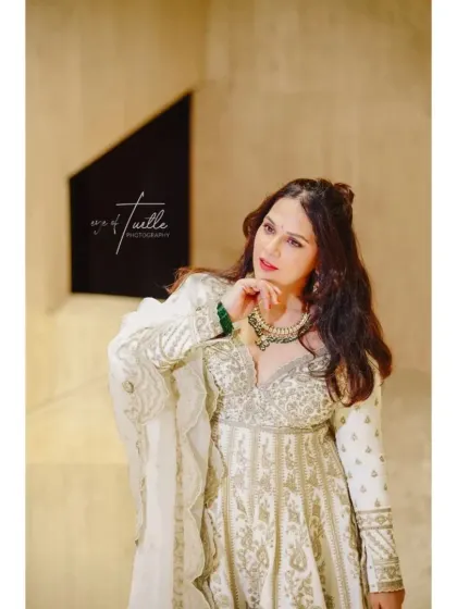 A thoughtful and beautiful portrait of the bride. The soft lighting and her gentle expression create a moment of serene beauty.
