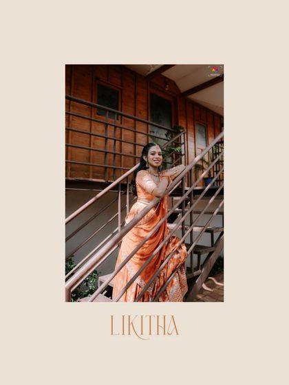 A relaxed and happy bridal portrait on a staircase. The bride's beautiful peach-colored lehenga shines in this candid moment, capturing her joyful spirit.