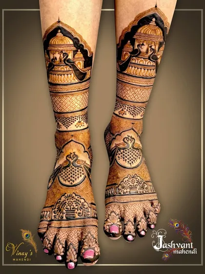 Another angle of the full-leg palace and peacock design, highlighting the symmetry and flow of the patterns from the toes to the shins.
