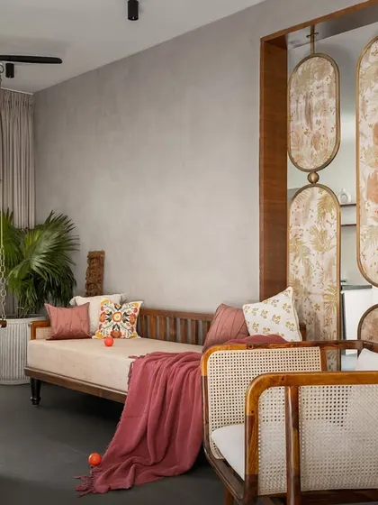 The living space of the 'Ittige' residence showcases our approach to modern Indian interiors. We integrated traditional elements like the wooden swing and cane furniture with a clean, contemporary layout, creating a space that feels both culturally rooted and refreshingly modern. The open plan allows for natural light to fill the room, connecting it to the outdoors.