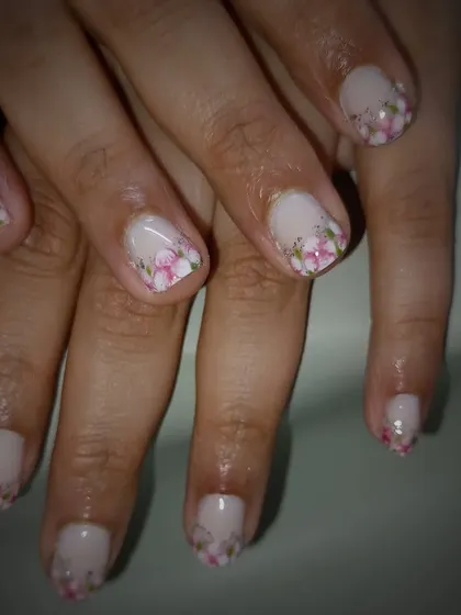 A beautiful manicure featuring tiny, real dried flowers encapsulated in the gel.