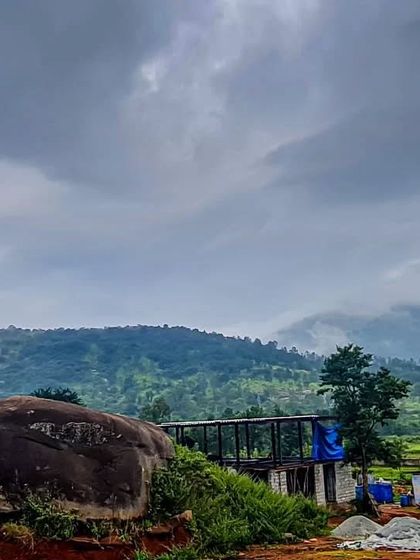 The site of the Soma house, with a large natural boulder in the foreground that we chose to preserve. The design process always begins with respecting the existing land, its features, and its moods.