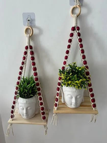 Bring a bit of nature indoors with my beaded macrame planter shelves. These are perfect for displaying small plants in your balcony, kitchen, or any cozy corner, adding a touch of green and handmade charm to your home.