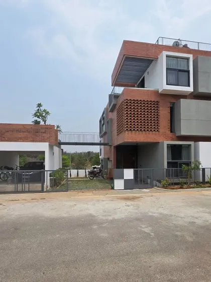 This completed residence in Tharalu, Bangalore, shows my approach to creating visual interest with materials and form. The design uses a mix of exposed brick jaali screens for ventilation and privacy, alongside stacked geometric volumes in plaster and concrete.