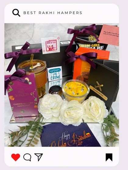 For a truly luxurious Rakhi gift, we present 'The Mirror Platter'. This stunning arrangement includes a personalized wallet, a sipper, various snacks, and is decorated with white carnations.