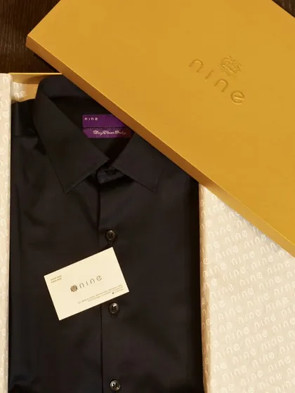 A bespoke shirt is a truly personal and useful gift. This crisp black shirt, made from fine cotton, is neatly packed in our branded gift box, making it an ideal choice for a special client or team member.