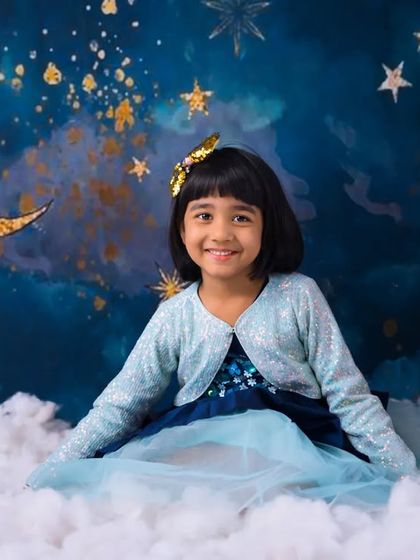 A princess sitting among the clouds. This dreamy moon and stars theme is a magical way to celebrate a birthday for an older child.
