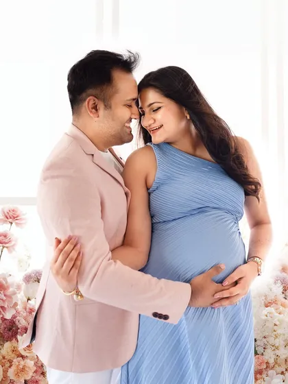 An intimate close-up of a couple during their maternity shoot. Poses like this, with foreheads touching, create a powerful sense of connection.