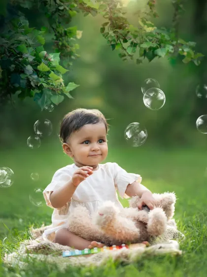 A moment of quiet curiosity during our outdoor bubble session. I love capturing the full range of your baby's expressions.
