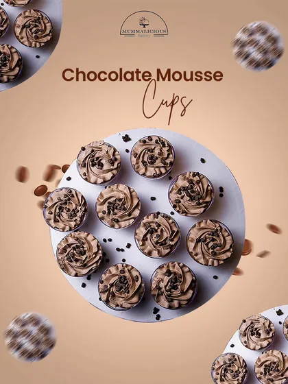 An aerial view of our chocolate mousse cups, ready for an event. Each cup is swirled with creamy chocolate mousse and sprinkled with chocolate chips.
