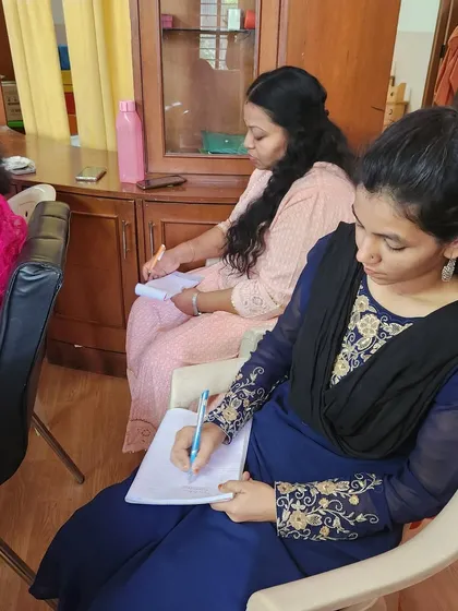 Our teachers diligently taking notes during the workshop on communication strategies, gaining invaluable tools to nurture our young learners.