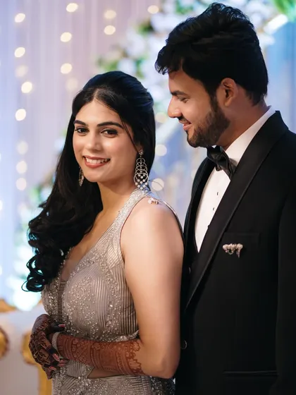 A beautiful portrait from the engagement party, with the soft bokeh of fairy lights creating a magical and celebratory atmosphere.