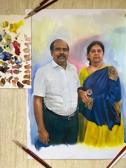 The finished oil painting of the Nagercoil couple, shown next to my color palette. You can see how I mix the skin tones and background colors.