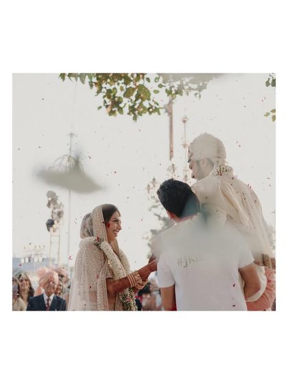 A behind-the-scenes shot of me, the photographer, capturing a moment during the wedding ceremony. It shows the process and dedication behind getting the perfect shot.