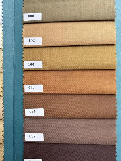 Our extensive range of brown and camel fabrics, perfect for crafting elegant and timeless menswear.