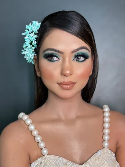 This final shot of the blue smokey eye look shows how it appears from a slight distance. It's bold yet elegant, a perfect style for your portfolio to attract clients looking for cocktail or reception makeup.