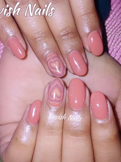 A unique "aura" design with a layered, airbrushed-style heart in the center of the accent nails.