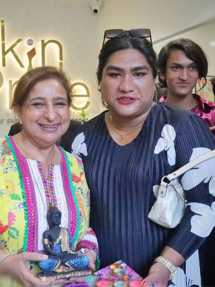 Our director with a community member during our Pride Month celebration. These connections are at the heart of what we do.