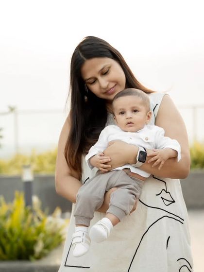 A tender moment between a mother and her baby during an outdoor rooftop shoot. The soft, natural light is perfect for these gentle portraits.