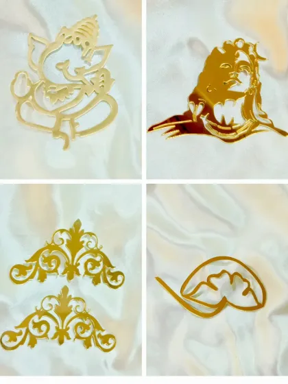 Our gold acrylic cutouts add a touch of elegance to any project. This set includes Ganesha and Shiva figures, as well as decorative corners and lotus feet for mantra frames.