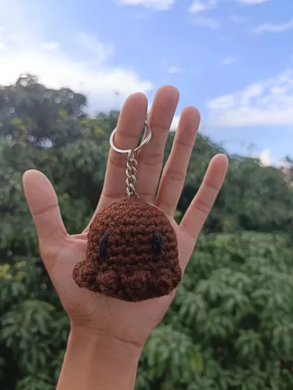 A custom-made octopus keychain in a rich brown color. I am always open to creating new and unique designs based on client requests.