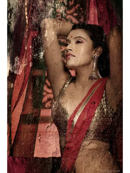 Classic Beauty. A portrait from the same series, focusing on the model's serene expression against a rich, textured, and colorful background.