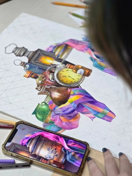 A close-up of the work in progress, showing the student's phone reference next to her drawing, highlighting the process of translating a digital image into a colored pencil artwork.