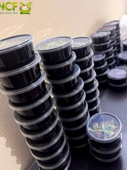 Getting our fresh side dishes ready for the Cheiraoba orders. Each container is filled with authentic Manipuri flavors, prepared hygienically for your enjoyment.