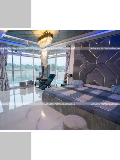 The master bedroom at Rock Villa, where I brought the resort feel indoors. The design combines a custom geometric headboard, elegant lighting, and floor-to-ceiling windows to create a luxurious space that still feels connected to the surrounding views.
