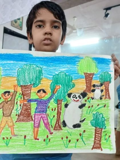 Aaryav, a 2nd standard student, drew this jungle scene with two friends and pandas. His oil pastel drawing tells a happy story of friendship in the wild.