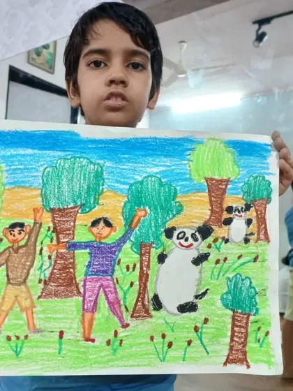 Aaryav, a 2nd standard student, drew this jungle scene with two friends and pandas. His oil pastel drawing tells a happy story of friendship in the wild.